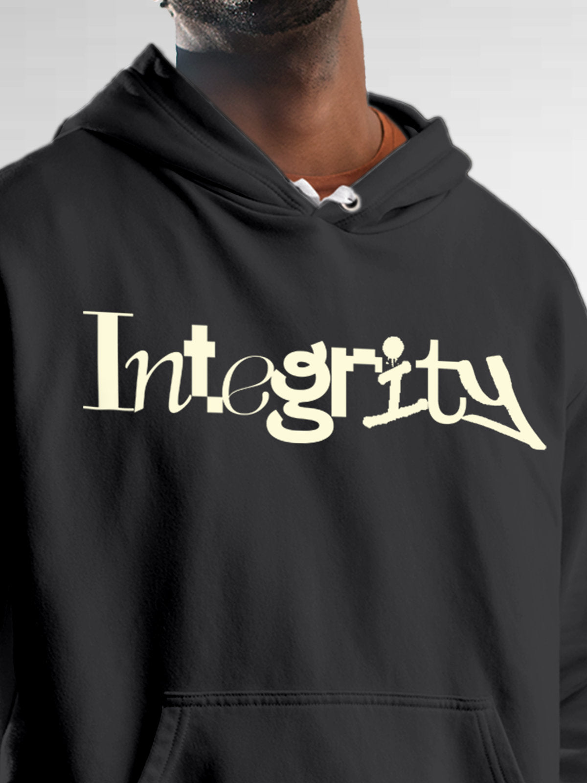 Close up of 'Integrity' design on Men's Dark Grey Hoodie Sweatshirt, highlighting intricate details and vibrant print.