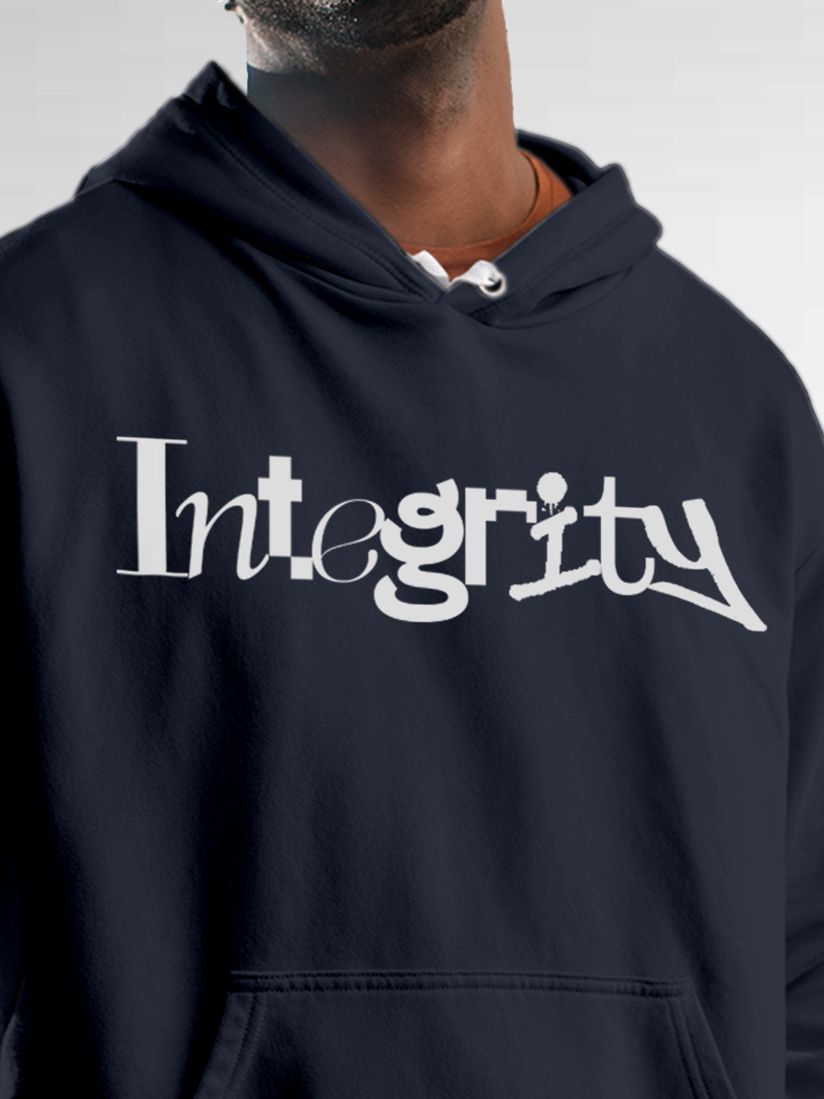 Close up of 'Integrity' design on Men's Navy Blue Hoodie Sweatshirt, highlighting intricate details and vibrant print.