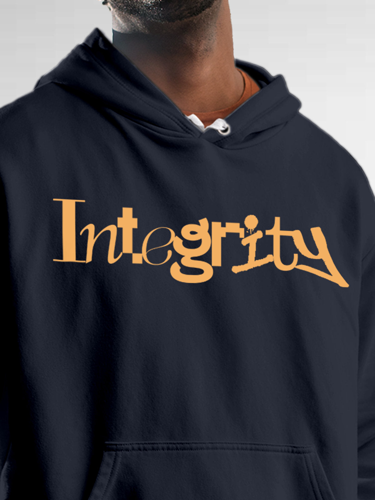 Close up of 'Integrity' design on Men's Navy Blue Hoodie Sweatshirt, highlighting intricate details and vibrant print.