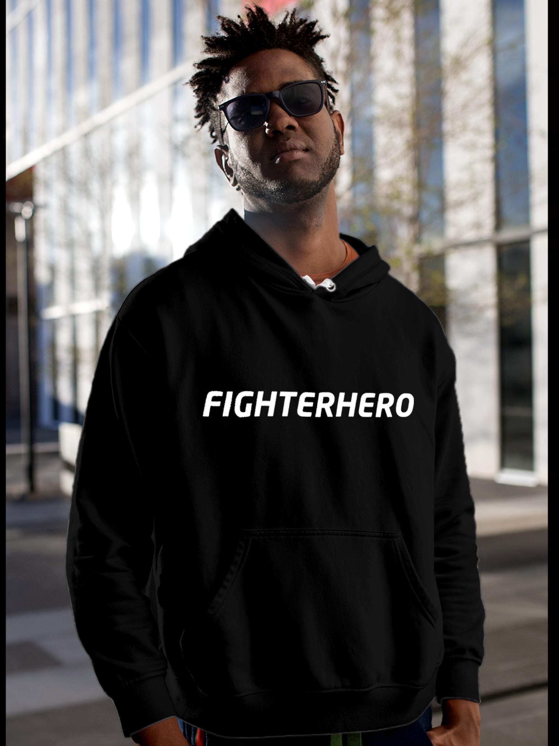 Model wearing Men's Black Hoodie Sweatshirt with 'Fighterhero' design, offering effortless style and premium comfort