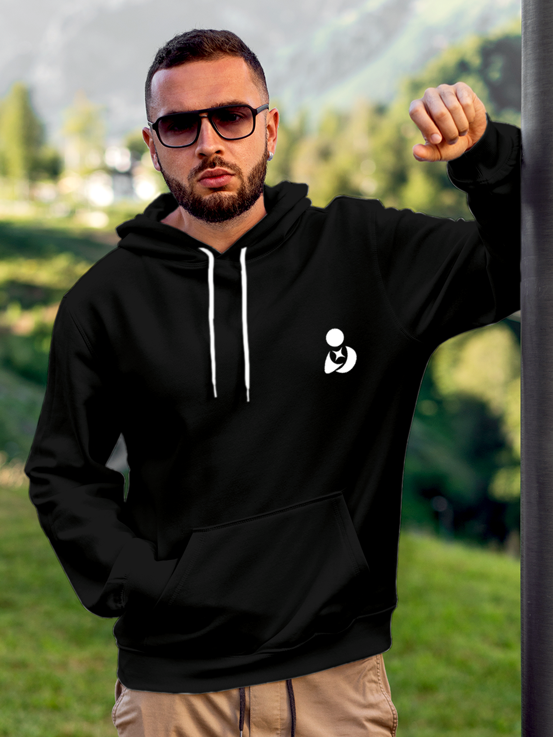 Model wearing Men's Solid Black Hoodie Sweatshirt with Fighterhero Logo, offering effortless style and premium comfort