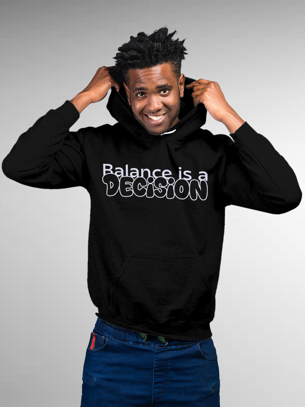 Model wearing Men's Black Hoodie Sweatshirt with 'Balance Is A Decision' design, offering effortless style and premium comfort