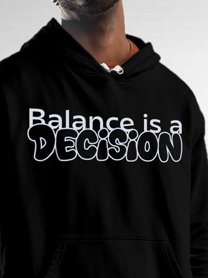 Close up of 'Balance Is A Decision' design on Men's Black Hoodie Sweatshirt, highlighting intricate details and vibrant print.