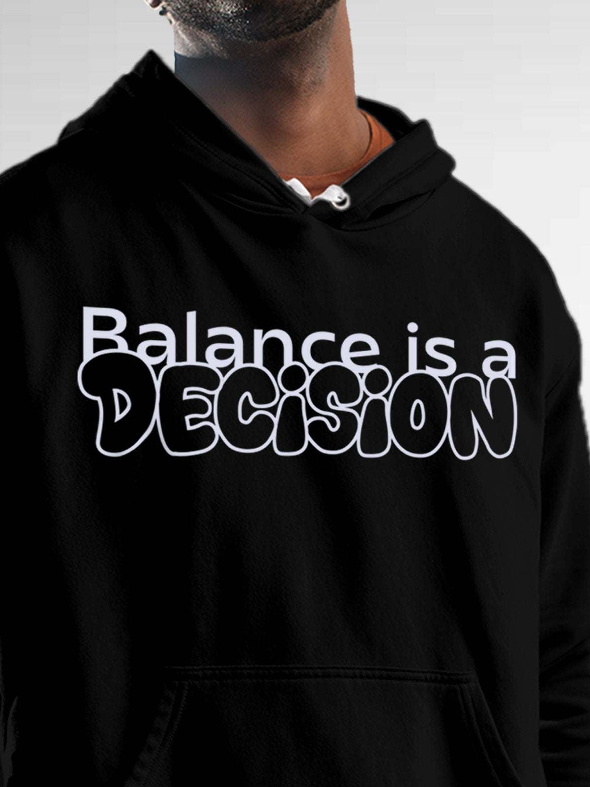 Close up of 'Balance Is A Decision' design on Men's Black Hoodie Sweatshirt, highlighting intricate details and vibrant print.