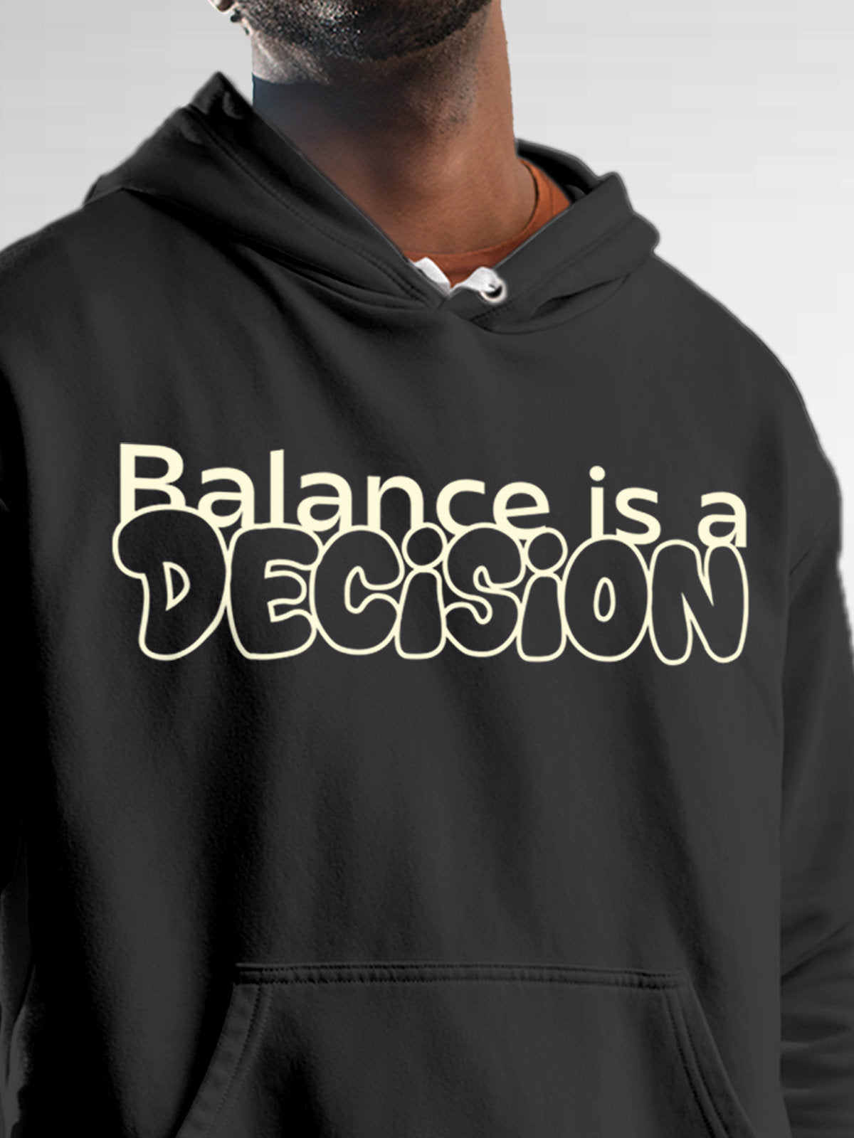 Close up of 'Balance Is A Decision' design on Men's Dark Grey Hoodie Sweatshirt, highlighting intricate details and vibrant print.