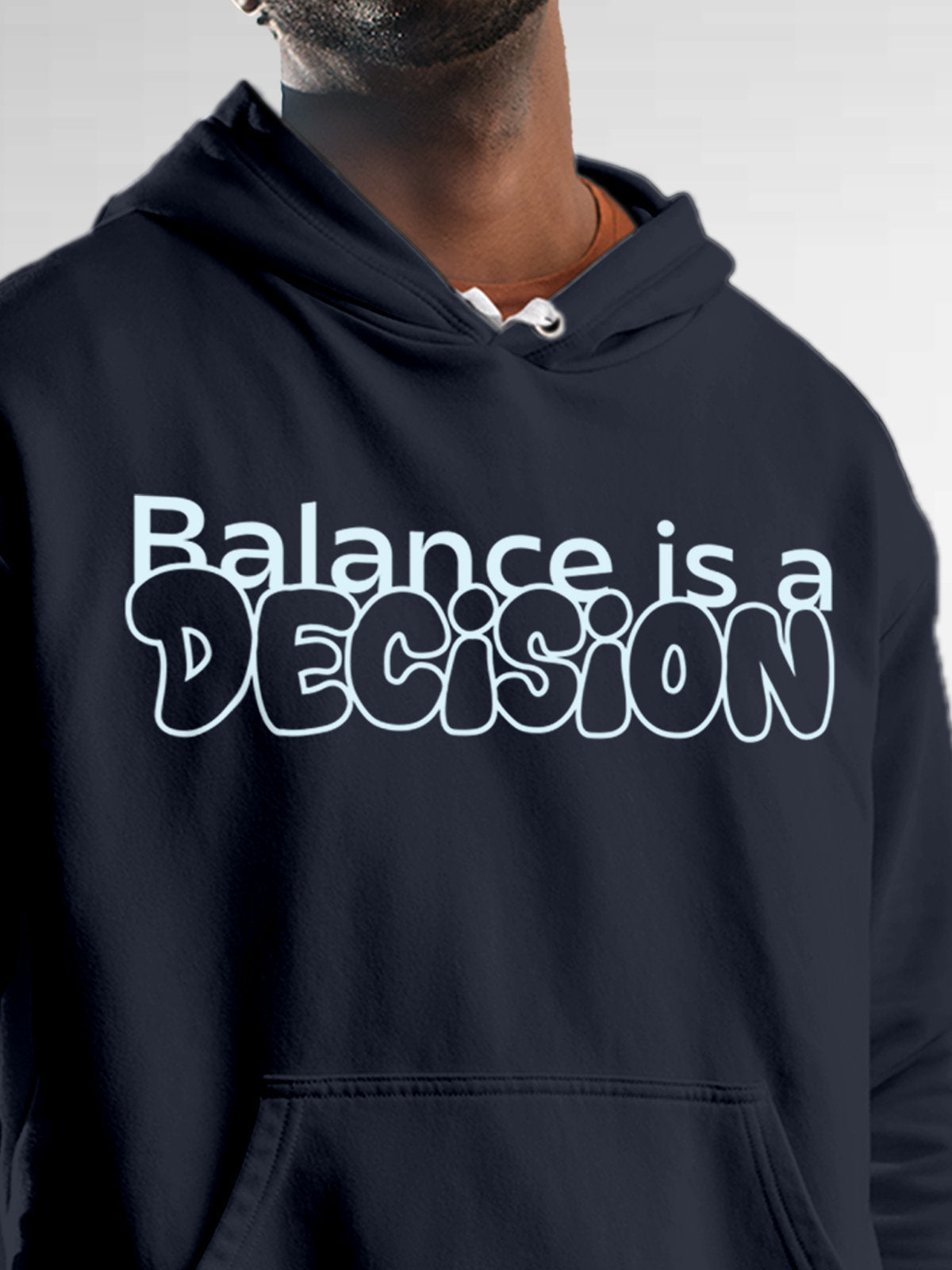 Close up of 'Balance Is A Decision' design on Men's Navy Blue Hoodie Sweatshirt, highlighting intricate details and vibrant print.