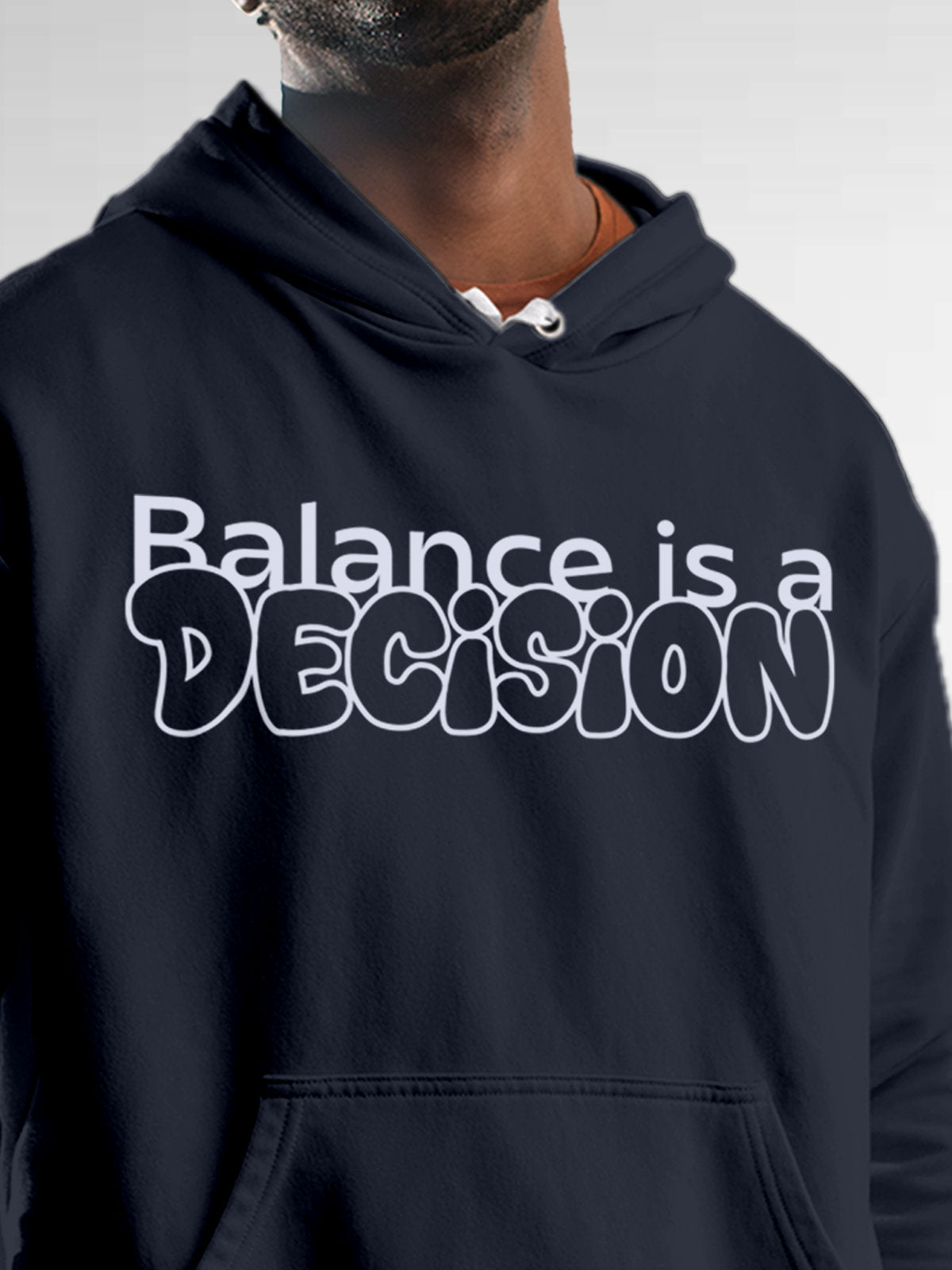 Close up of 'Balance Is A Decision' design on Men's Navy Blue Hoodie Sweatshirt, highlighting intricate details and vibrant print.