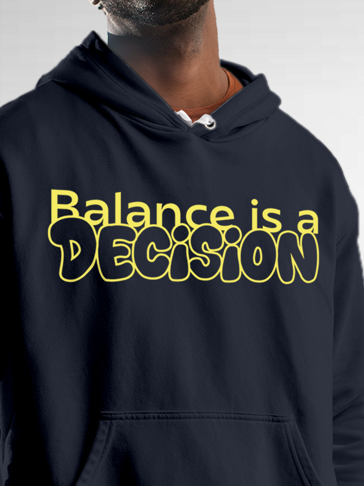 Close up of 'Balance Is A Decision' design on Men's Navy Blue Hoodie Sweatshirt, highlighting intricate details and vibrant print.