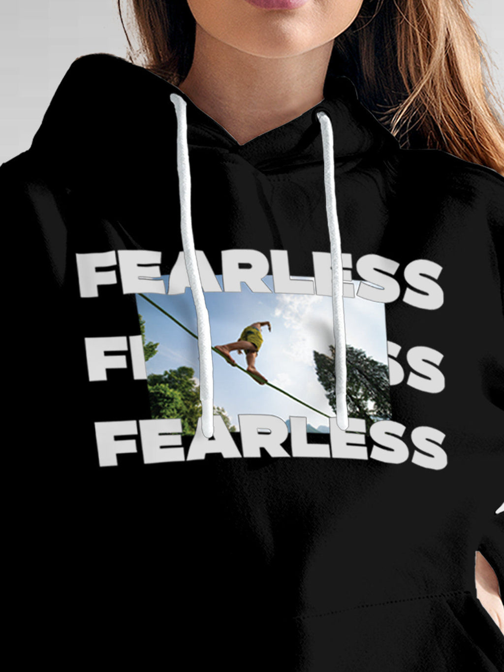 Close up of 'Fearless' design on Women's Black Hoodie Sweatshirt, highlighting intricate details and vibrant print.