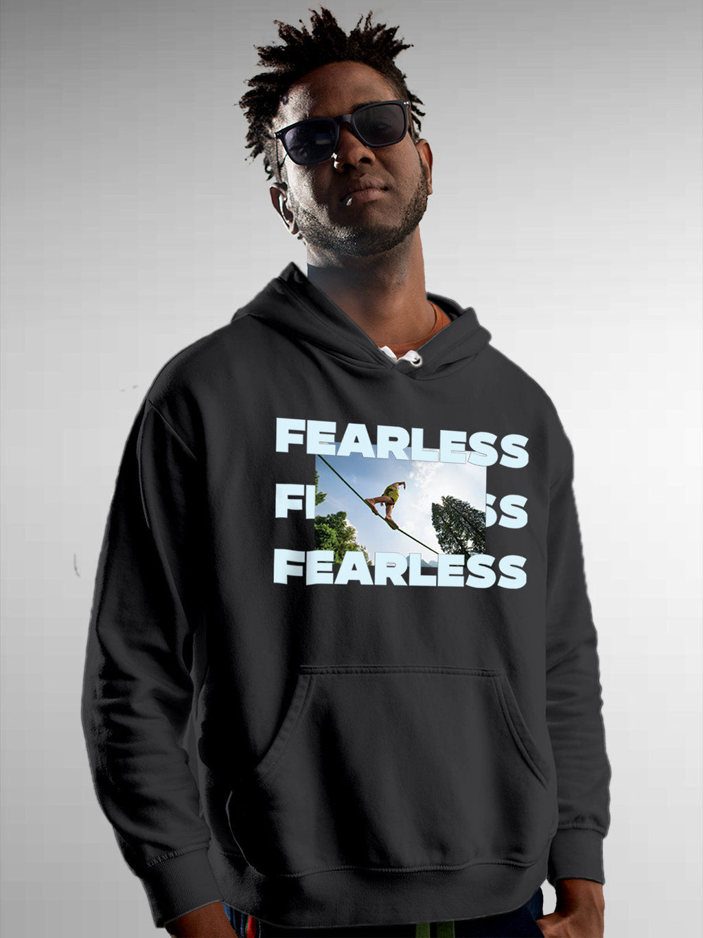 Model wearing Men's Dark Grey Hoodie Sweatshirt with 'Fearless' design, offering effortless style and premium comfort