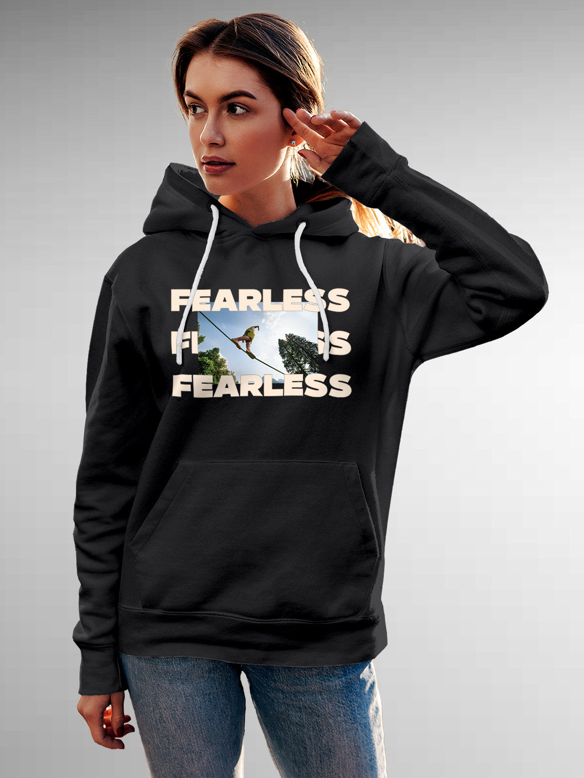 Model wearing Women's Dark Grey Hoodie Sweatshirt with 'Fearless' design, offering effortless style and premium comfort