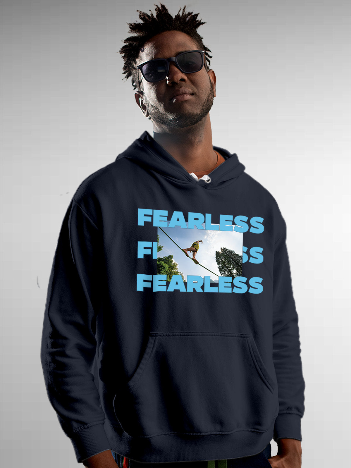 Model wearing Men's Navy Blue Hoodie Sweatshirt with 'Fearless' design, offering effortless style and premium comfort