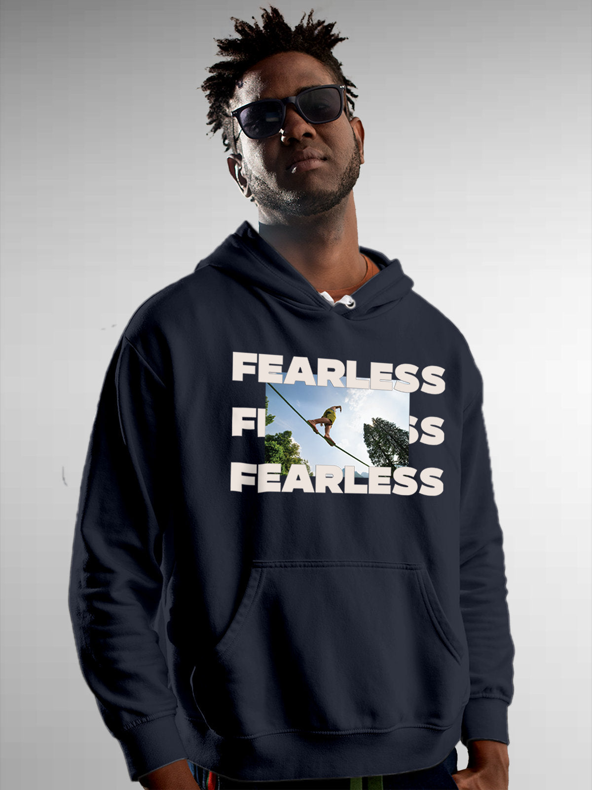 Model wearing Men's Navy Blue Hoodie Sweatshirt with 'Fearless' design, offering effortless style and premium comfort