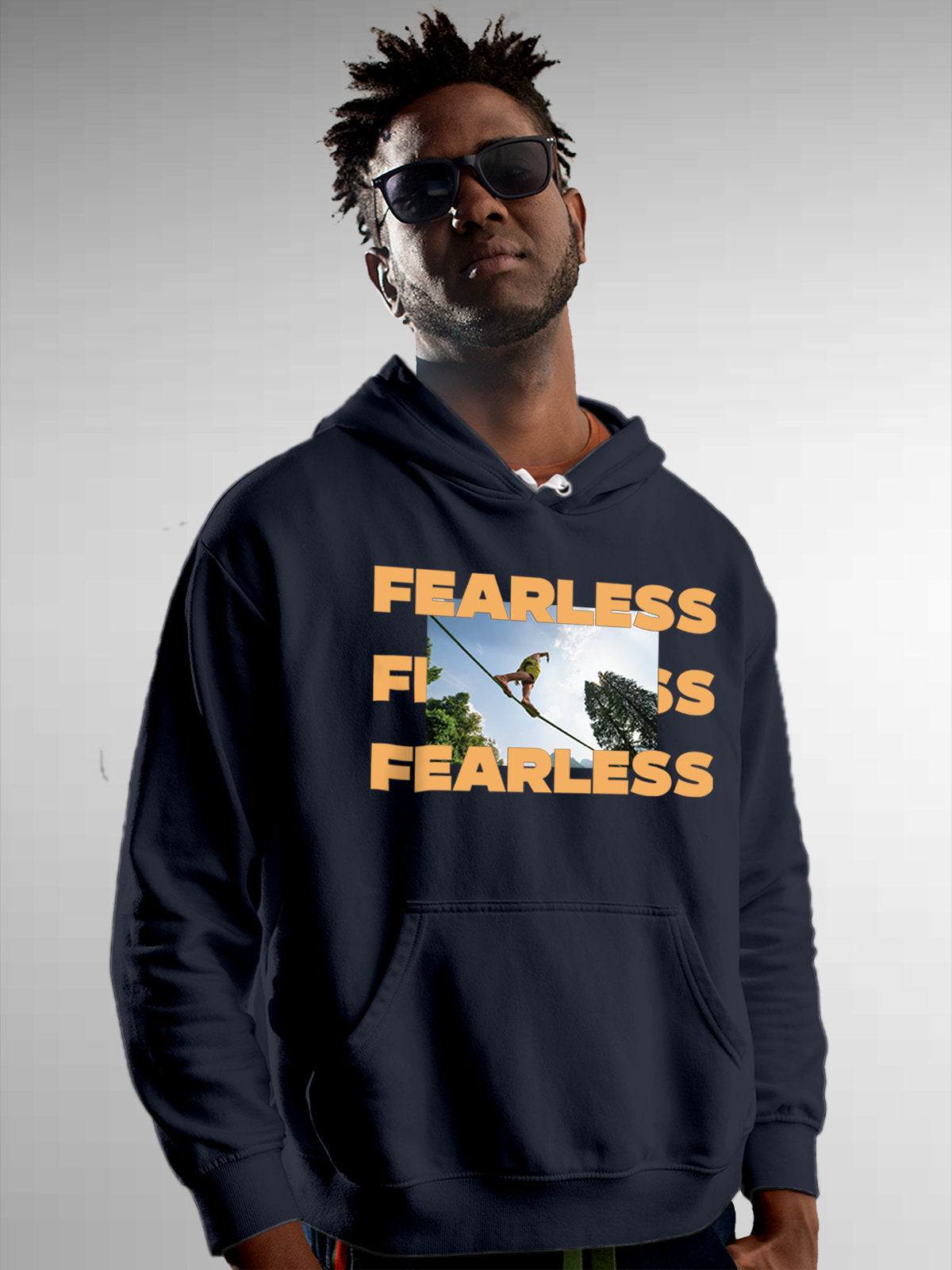 Model wearing Men's Navy Blue Hoodie Sweatshirt with 'Fearless' design, offering effortless style and premium comfort