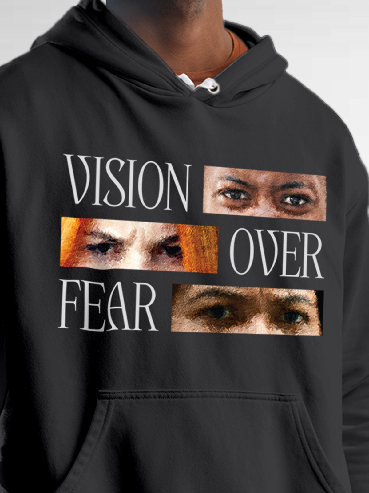 Close up of 'Vision Over Fear' design on Men's Dark Grey Hoodie Sweatshirt, highlighting intricate details and vibrant print.