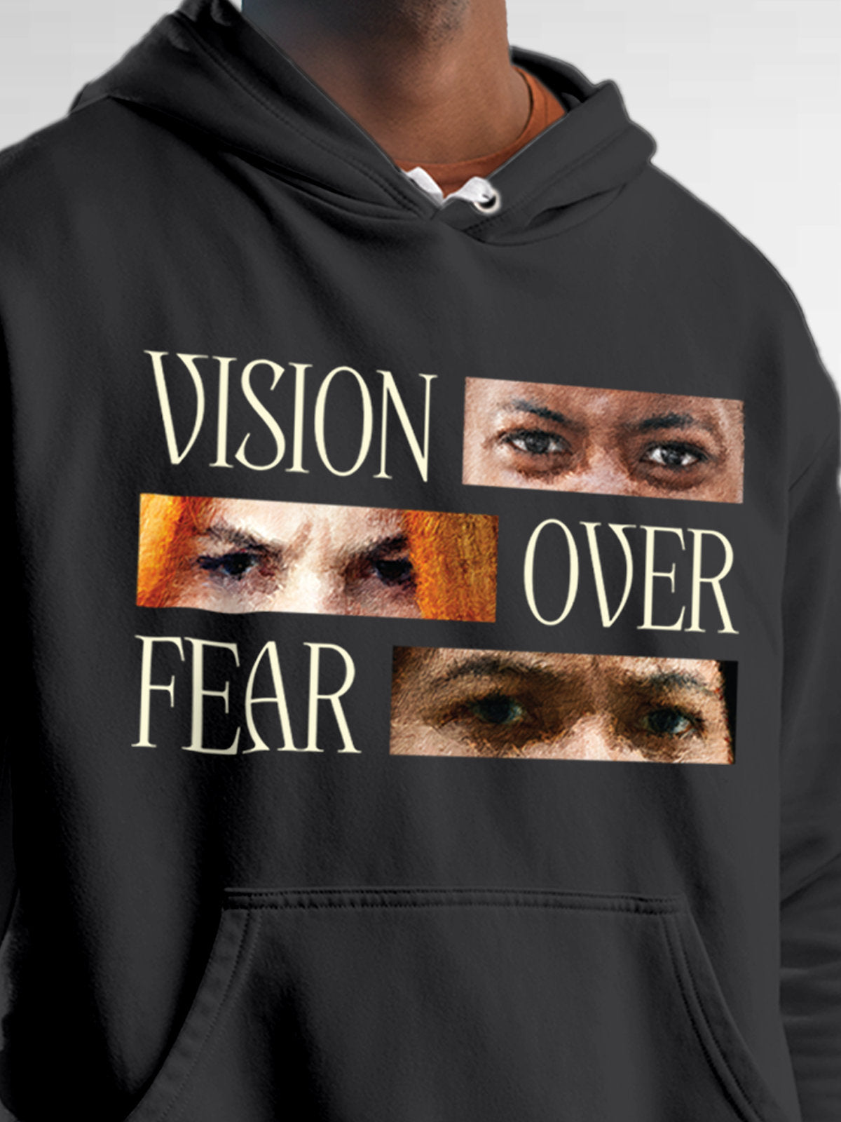 Close up of 'Vision Over Fear' design on Men's Dark Grey Hoodie Sweatshirt, highlighting intricate details and vibrant print.