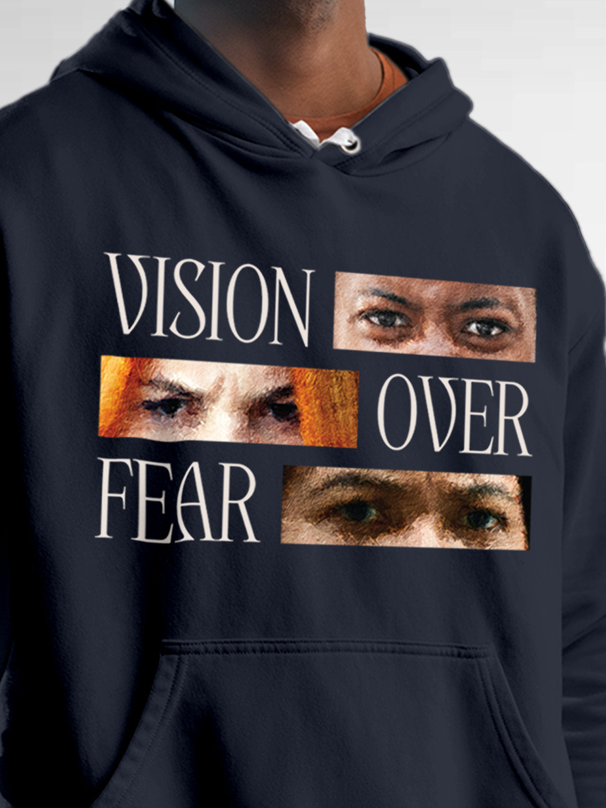Close up of 'Vision Over Fear' design on Men's Navy Blue Hoodie Sweatshirt, highlighting intricate details and vibrant print.