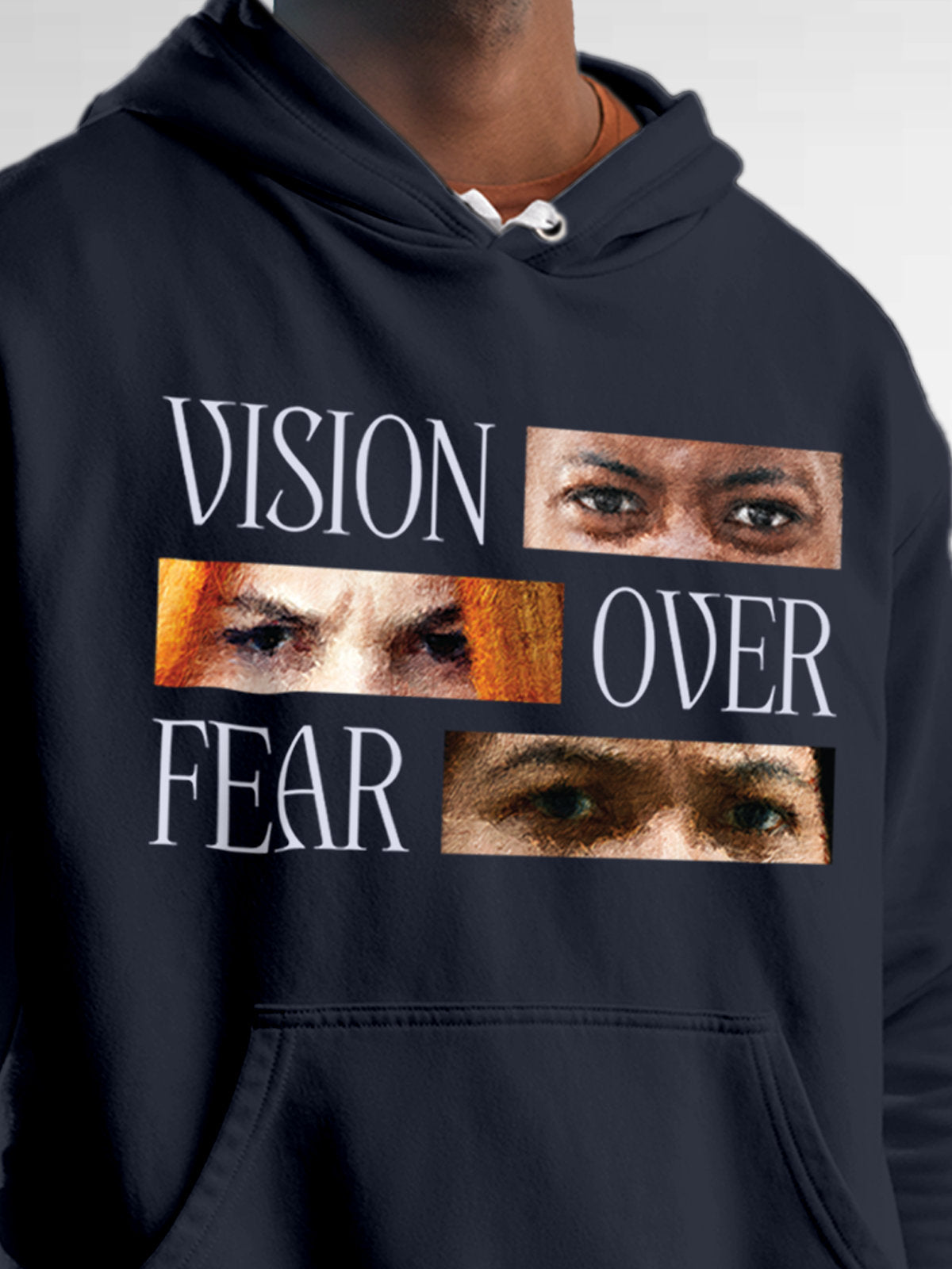 Close up of 'Vision Over Fear' design on Men's Navy Blue Hoodie Sweatshirt, highlighting intricate details and vibrant print.