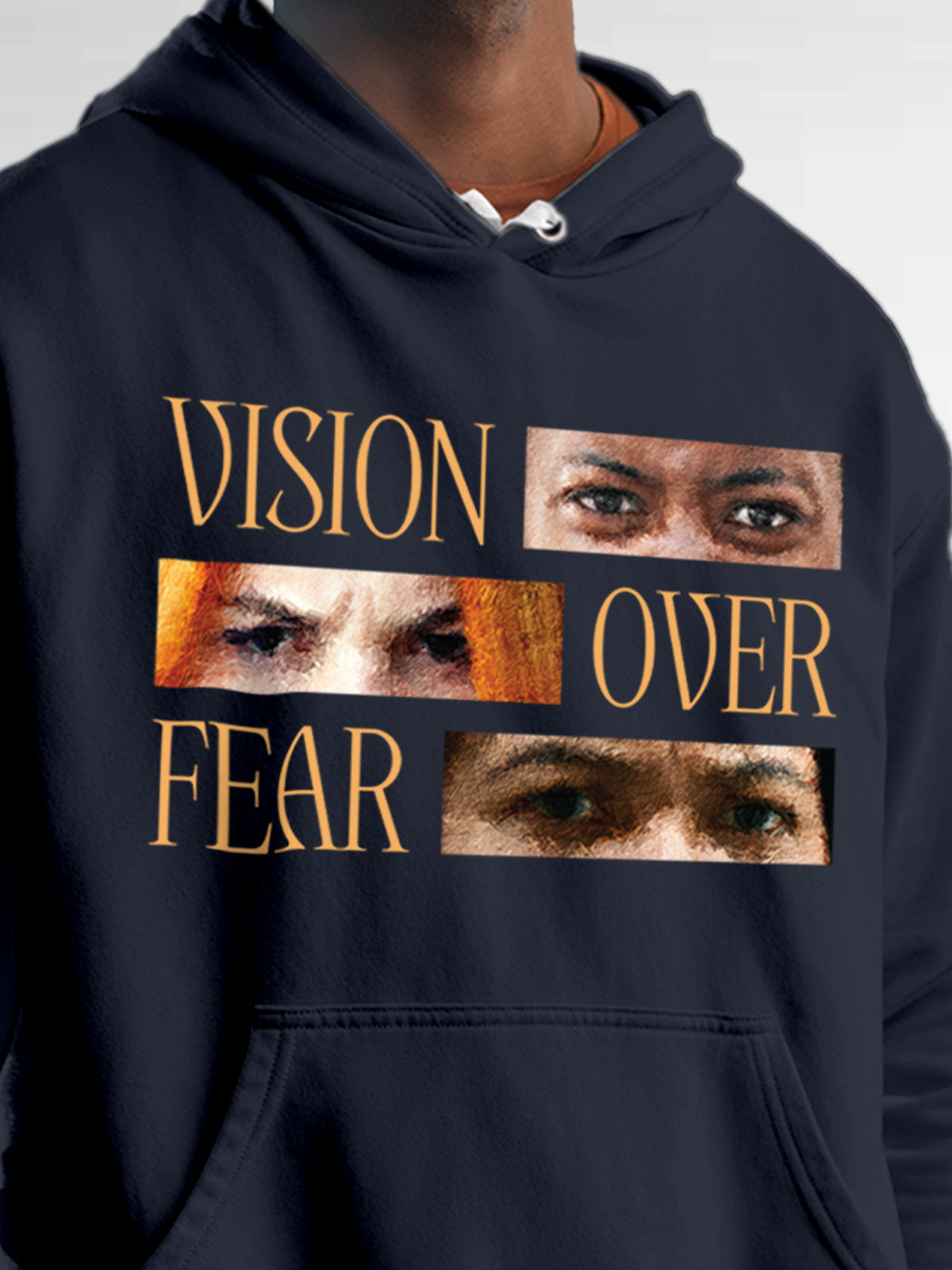 Close up of 'Vision Over Fear' design on Men's Navy Blue Hoodie Sweatshirt, highlighting intricate details and vibrant print.