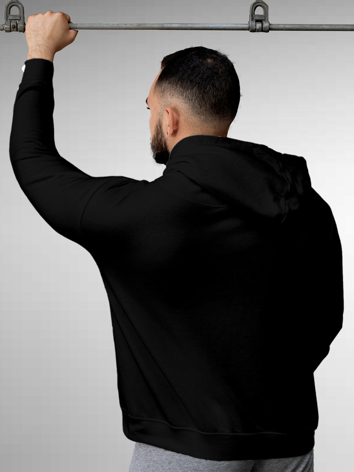 Back view of Fighterhero Men's Black Hoodie Sweatshirt, highlighting the modern look and clean finish