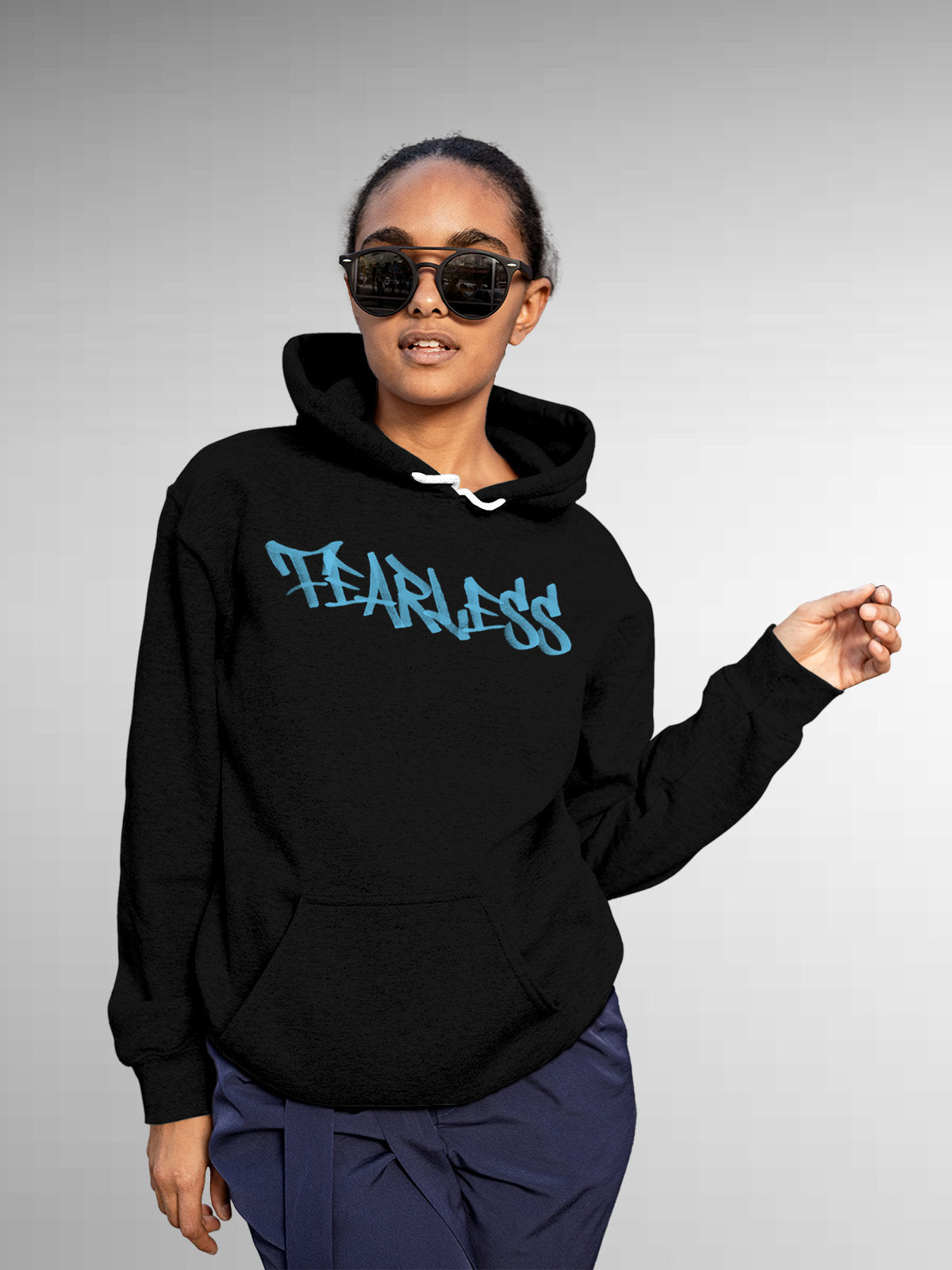 Model wearing Women's Black Hoodie Sweatshirt with 'Fearless' design, offering effortless style and premium comfort