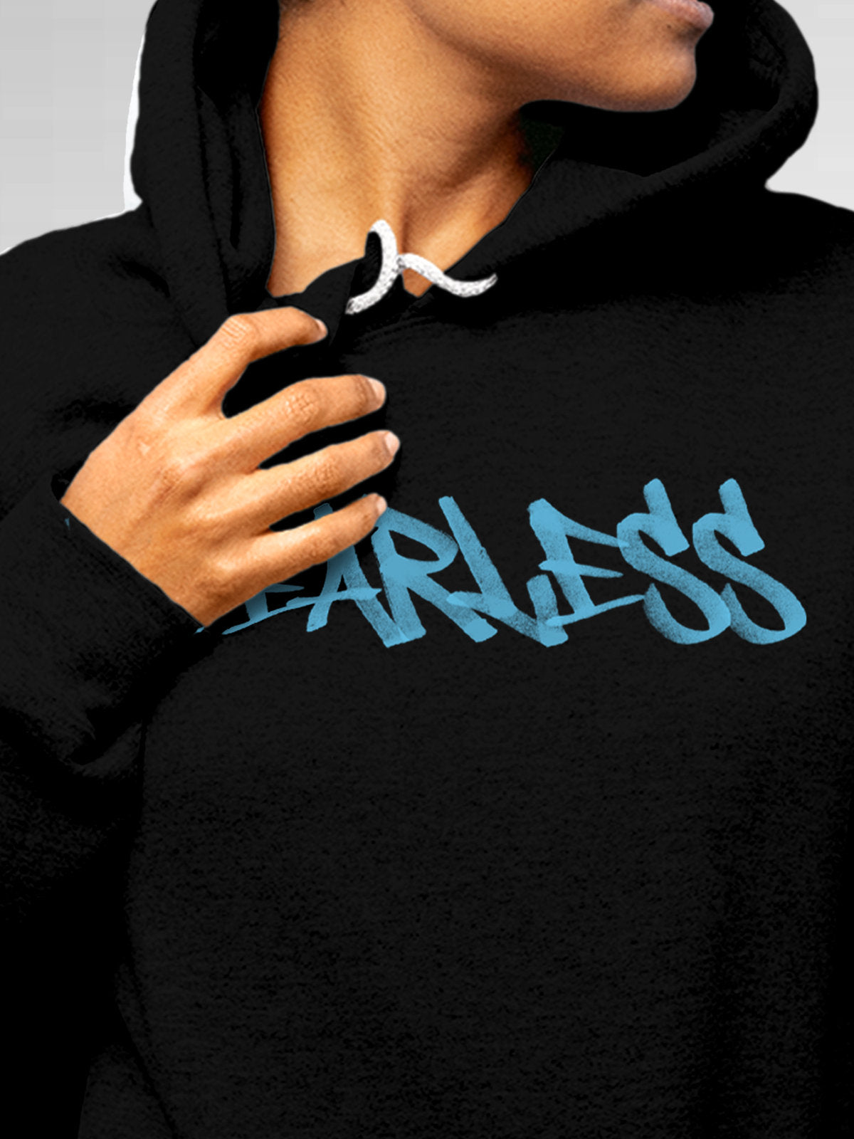 Close up of 'Fearless' design on Women's Black Hoodie Sweatshirt, highlighting intricate details and vibrant print.