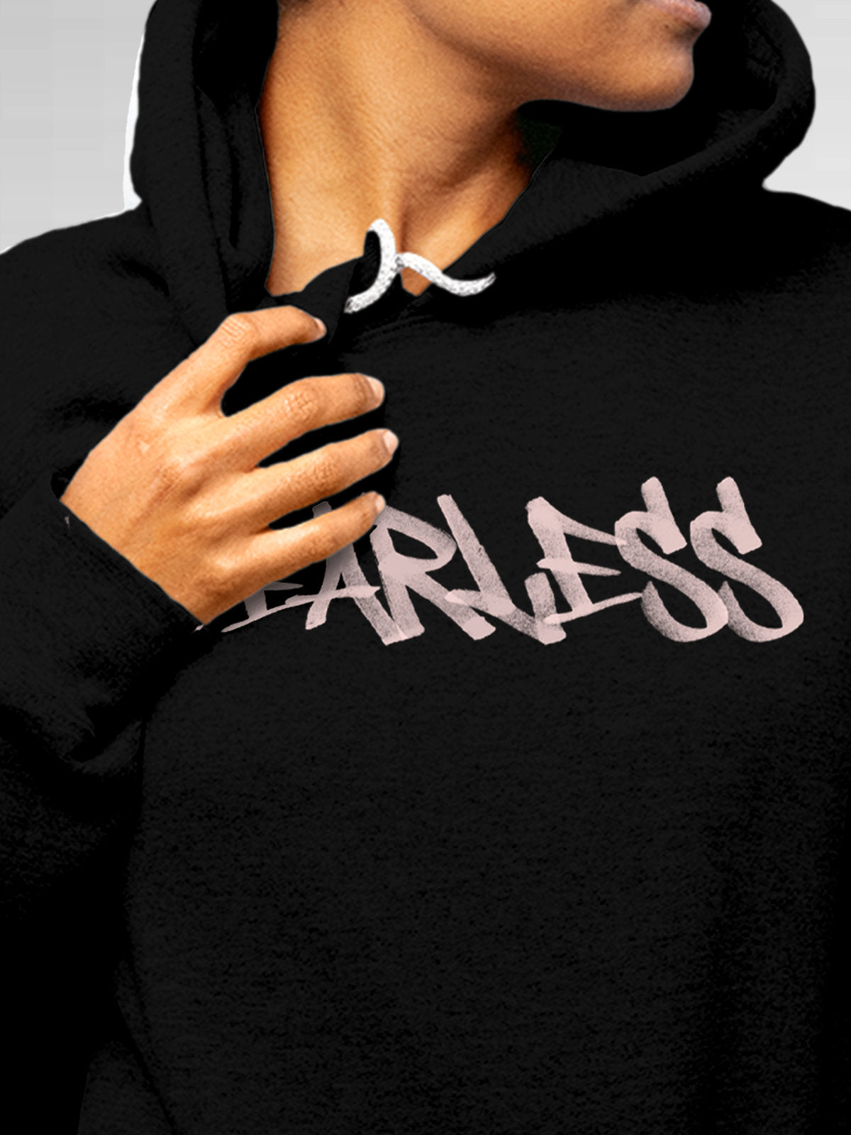 Close up of 'Fearless' design on Women's Black Hoodie Sweatshirt, highlighting intricate details and vibrant print.