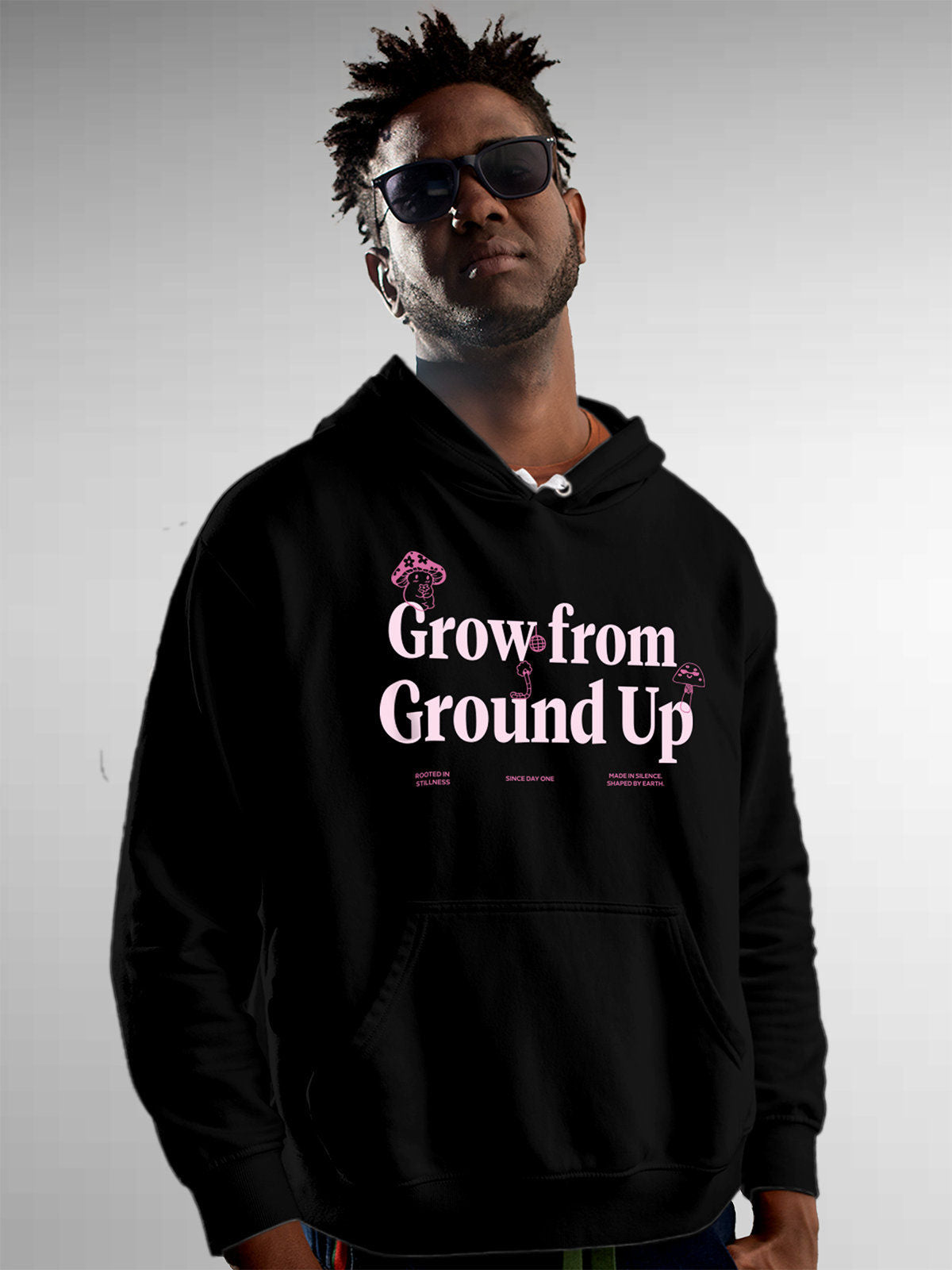 Model wearing Men's Black Hoodie Sweatshirt with 'Grow From Ground Up' design, offering effortless style and premium comfort