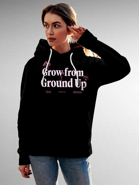 Model wearing Women's Black Hoodie Sweatshirt with 'Grow From Ground Up' design, offering effortless style and premium comfort