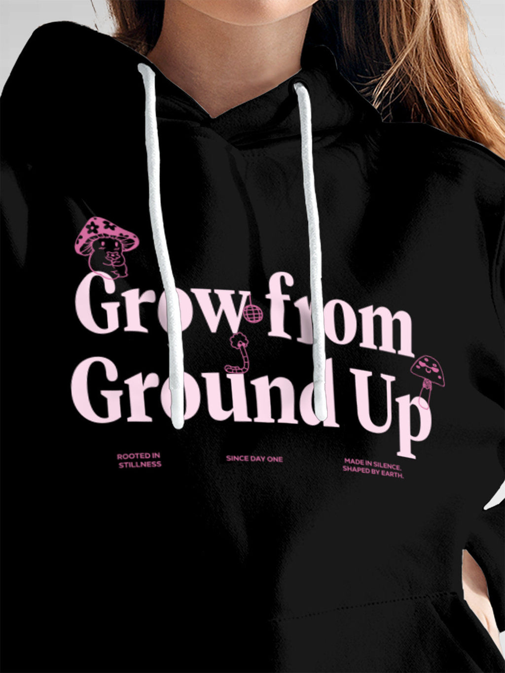 Close up of 'Grow From Ground Up' design on Women's Black Hoodie Sweatshirt, highlighting intricate details and vibrant print.