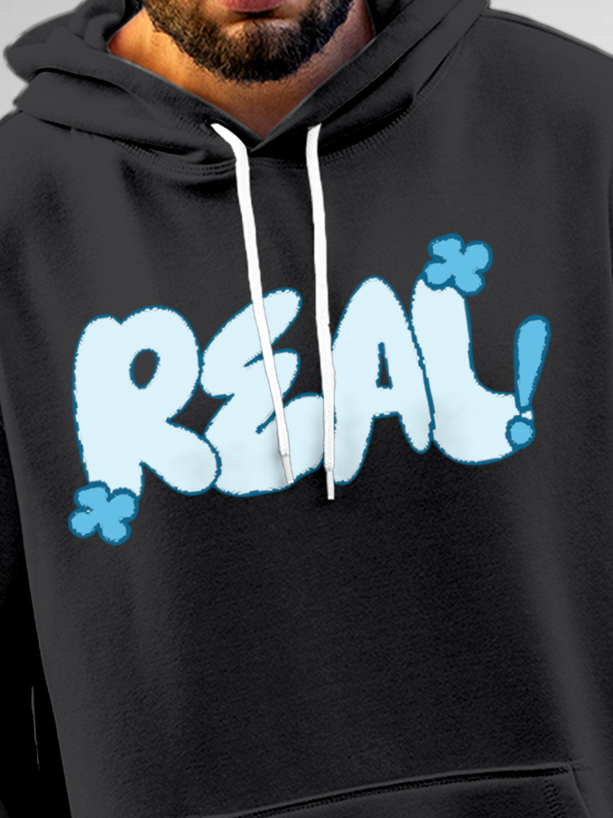 Close up of 'Real' design on Men's Dark Grey Hoodie Sweatshirt, highlighting intricate details and vibrant print.