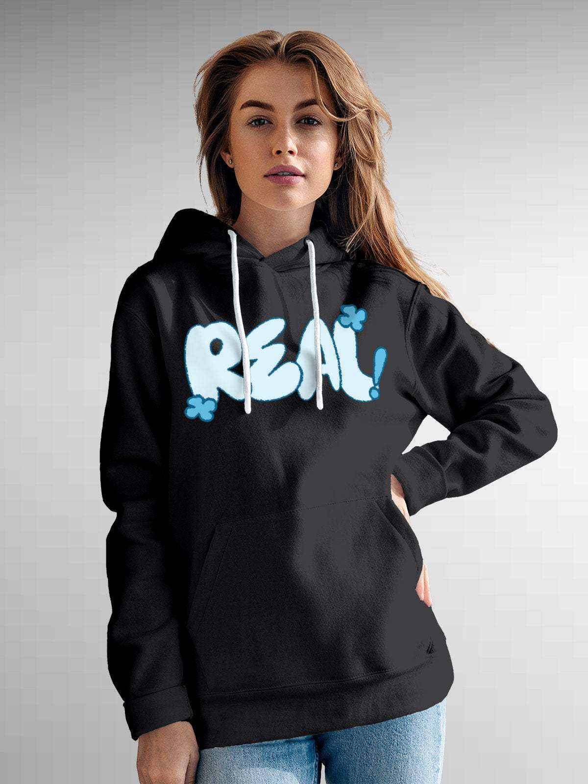 Model wearing Women's Dark Grey Hoodie Sweatshirt with 'Real' design, offering effortless style and premium comfort