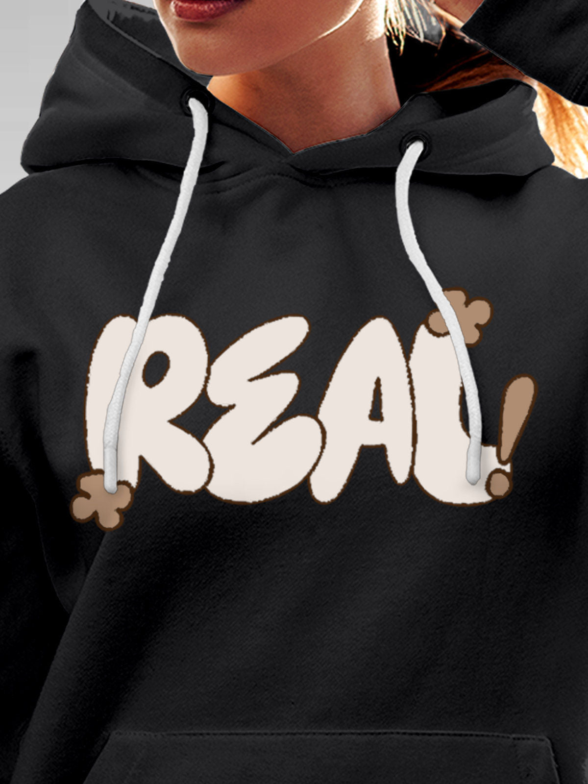 Close up of 'Real' design on Women's Dark Grey Hoodie Sweatshirt, highlighting intricate details and vibrant print.