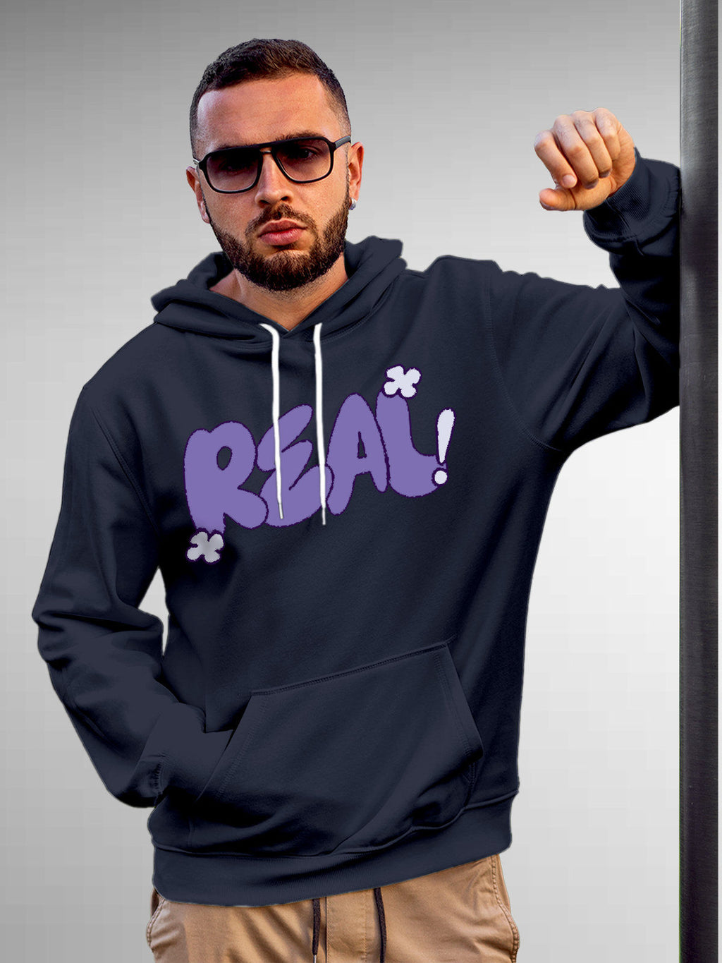 Model wearing Men's Navy Blue Hoodie Sweatshirt with 'Real' design, offering effortless style and premium comfort