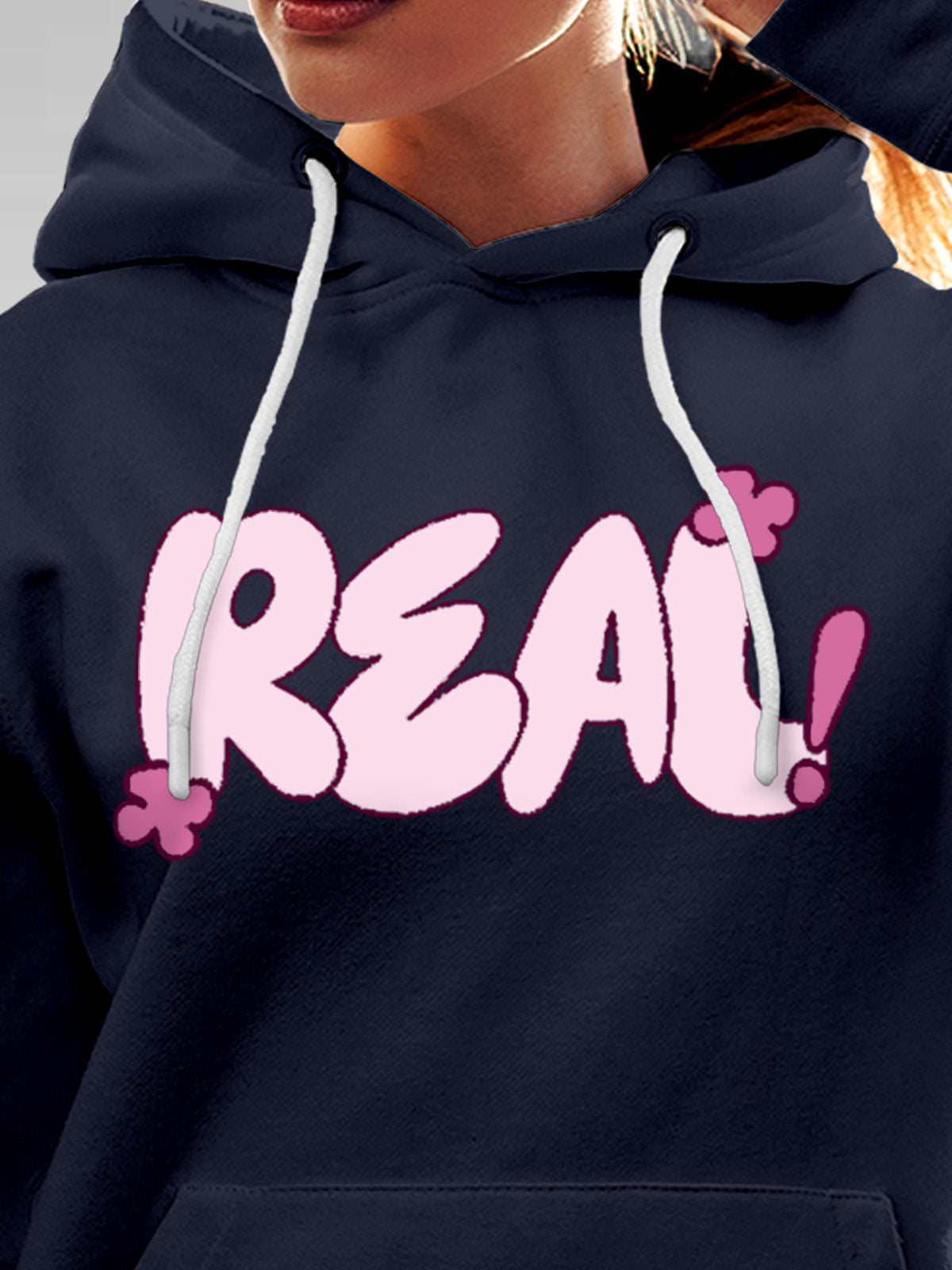 Close up of 'Real' design on Women's Navy Blue Hoodie Sweatshirt, highlighting intricate details and vibrant print.