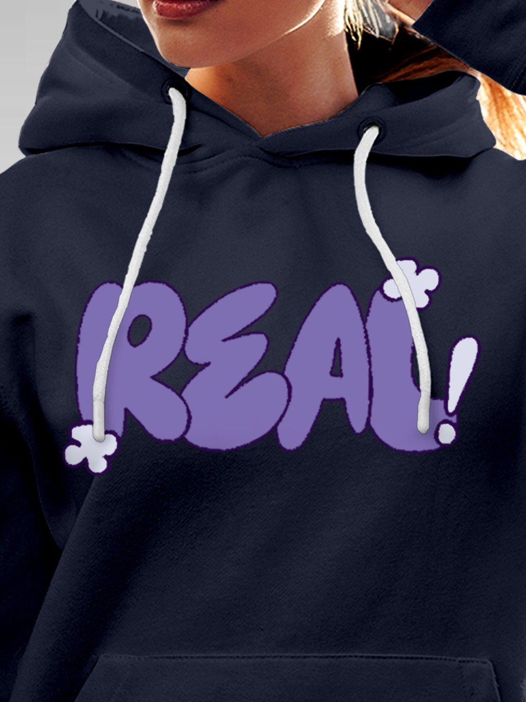Close up of 'Real' design on Women's Navy Blue Hoodie Sweatshirt, highlighting intricate details and vibrant print.