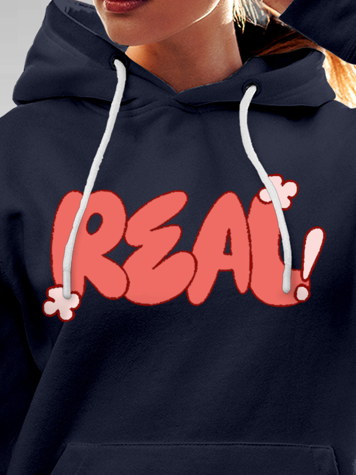 Close up of 'Real' design on Women's Navy Blue Hoodie Sweatshirt, highlighting intricate details and vibrant print.
