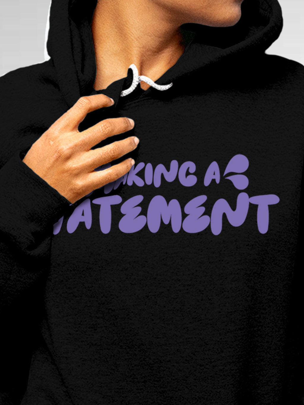 Close up of 'Making A Statement' design on Women's Black Hoodie Sweatshirt, highlighting intricate details and vibrant print.