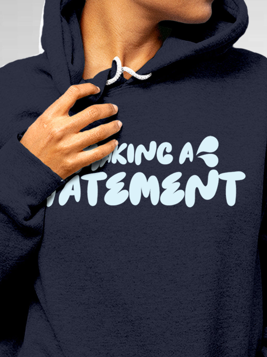 Close up of 'Making A Statement' design on Women's Navy Blue Hoodie Sweatshirt, highlighting intricate details and vibrant print.