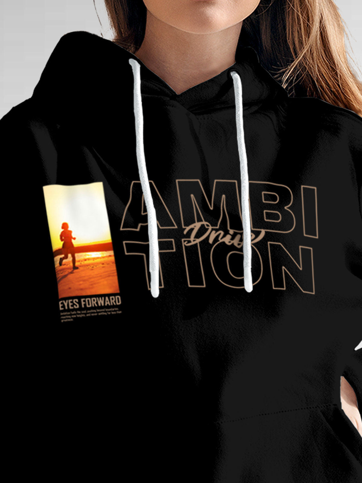 Close up of 'Ambition & Drive' design on Women's Black Hoodie Sweatshirt, highlighting intricate details and vibrant print.