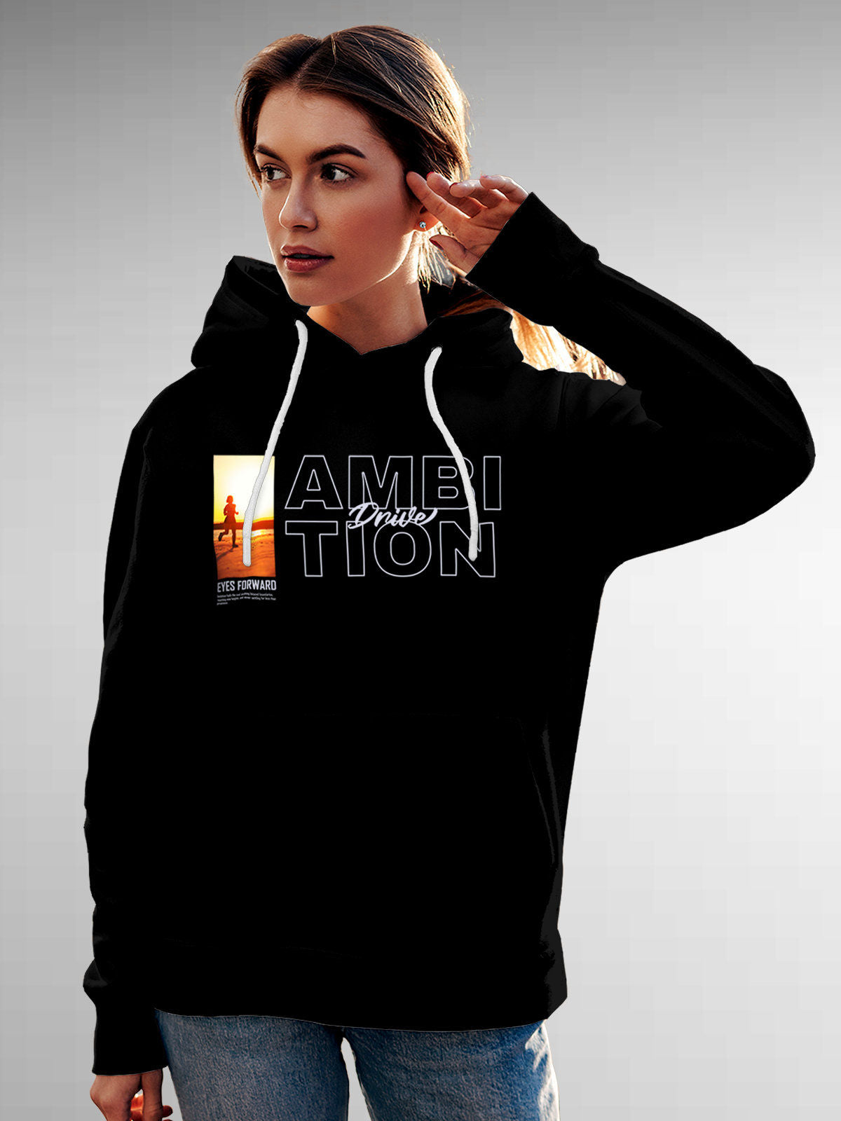 Model wearing Women's Black Hoodie Sweatshirt with 'Ambition & Drive' design, offering effortless style and premium comfort