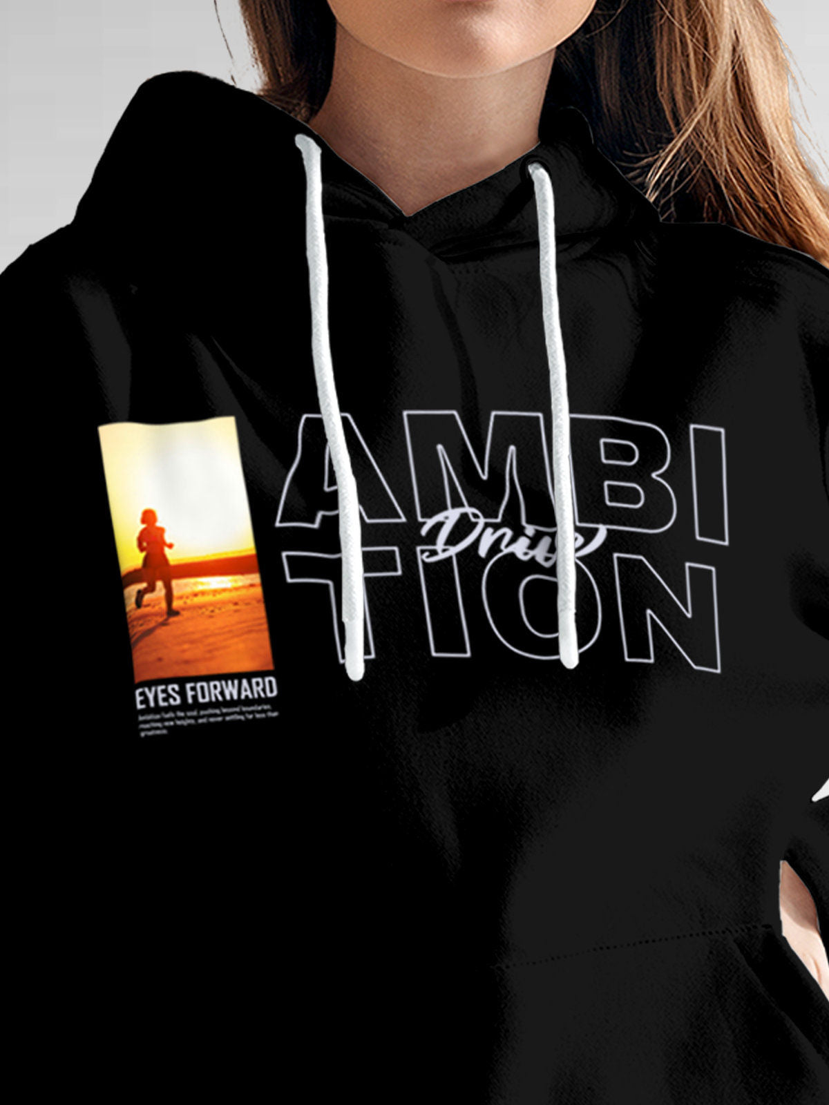 Close up of 'Ambition & Drive' design on Women's Black Hoodie Sweatshirt, highlighting intricate details and vibrant print.