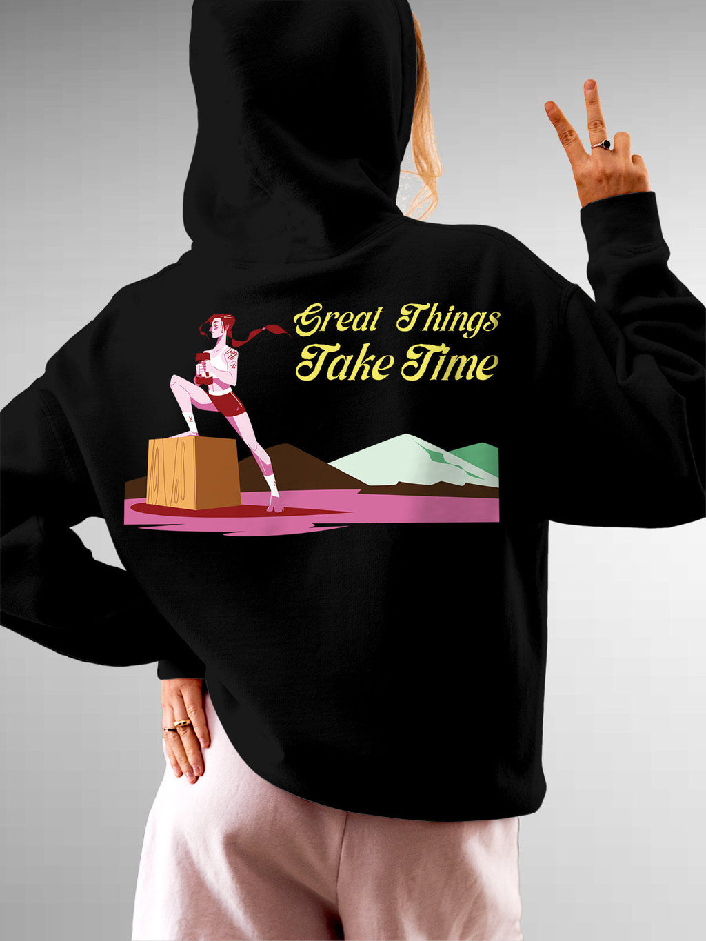 Model wearing Women's Black Hoodie Sweatshirt with 'Never Give Up' design, offering effortless style and premium comfort