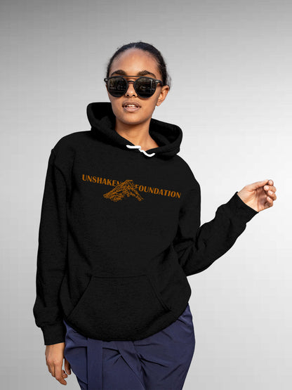 Model wearing Women's Black Hoodie Sweatshirt with 'Unshaken Foundation' design, offering effortless style and premium comfort