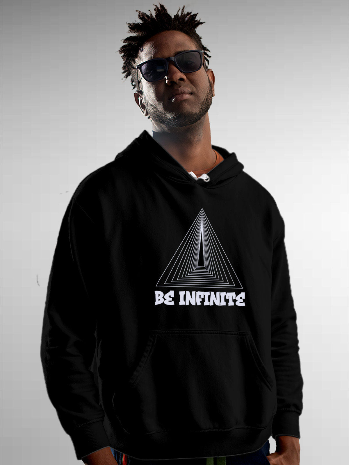 Model wearing Men's Black Hoodie Sweatshirt with 'Be Infinite' design, offering effortless style and premium comfort