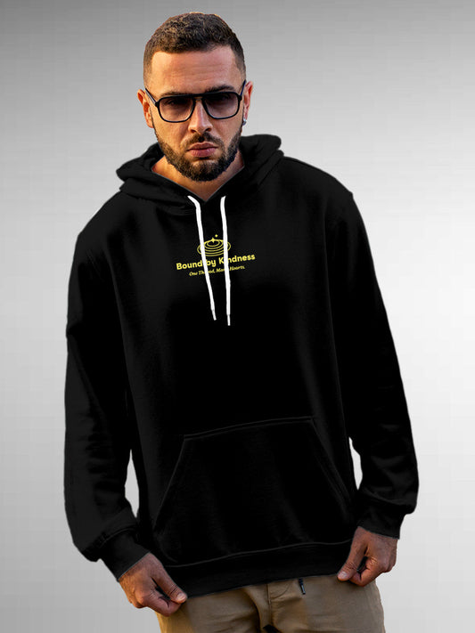 Model wearing Men's Black Hoodie Sweatshirt with 'Bound By Kindness' design, offering effortless style and premium comfort