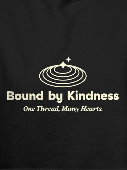 Close up of 'Bound By Kindness' design on Women's Dark Grey Hoodie Sweatshirt, highlighting intricate details and vibrant print.