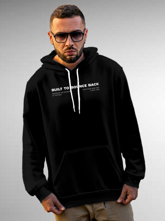 Model wearing Men's Black Hoodie Sweatshirt with 'Built To Bounce Back' design, offering effortless style and premium comfort