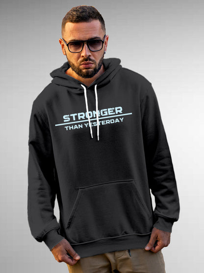Model wearing Men's Dark Grey Hoodie Sweatshirt with 'Stronger Than Yesterday' design, offering effortless style and premium comfort