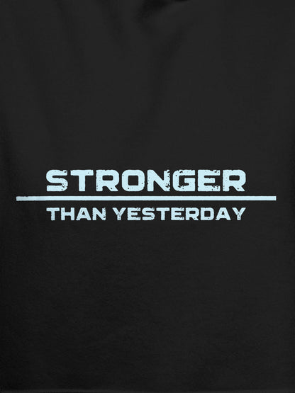Close up of 'Stronger Than Yesterday' design on Men's Dark Grey Hoodie Sweatshirt, highlighting intricate details and vibrant print.
